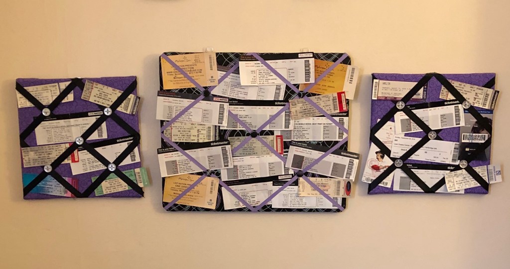 Three memo boards with concert tickets on them